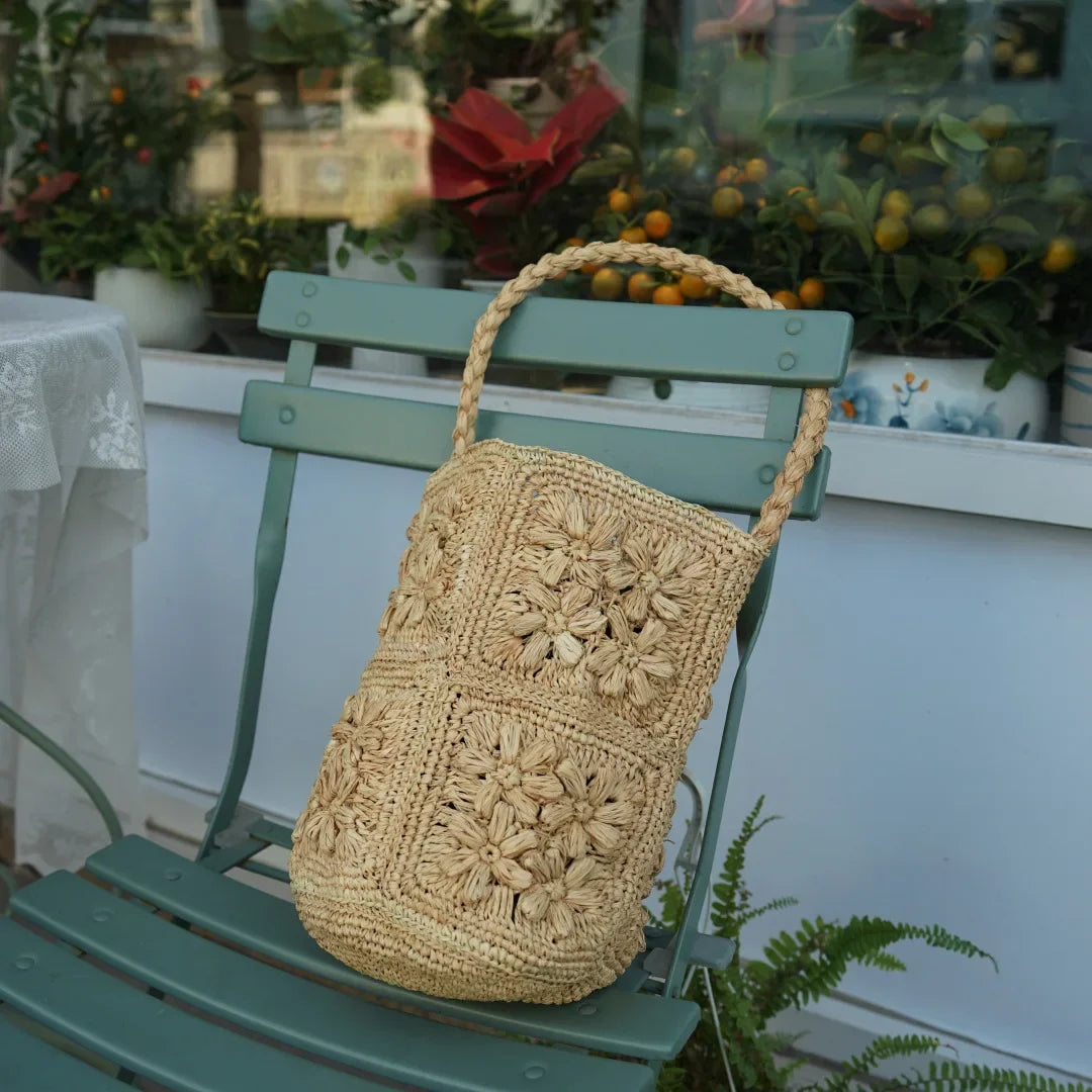 New French Handmade Lafite Grass Hollowed Out Woven Flower Petal Pattern Portable Women's Bag Seaside Vacation Fashion Bag Trend