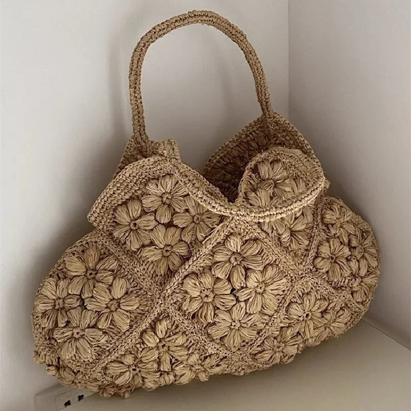 New French Handmade Lafite Grass Hollowed Out Woven Flower Petal Pattern Portable Women's Bag Seaside Vacation Fashion Bag Trend