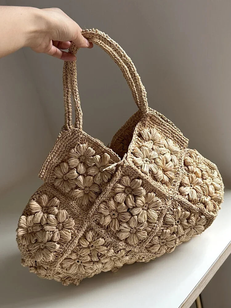New French Handmade Lafite Grass Hollowed Out Woven Flower Petal Pattern Portable Women's Bag Seaside Vacation Fashion Bag Trend