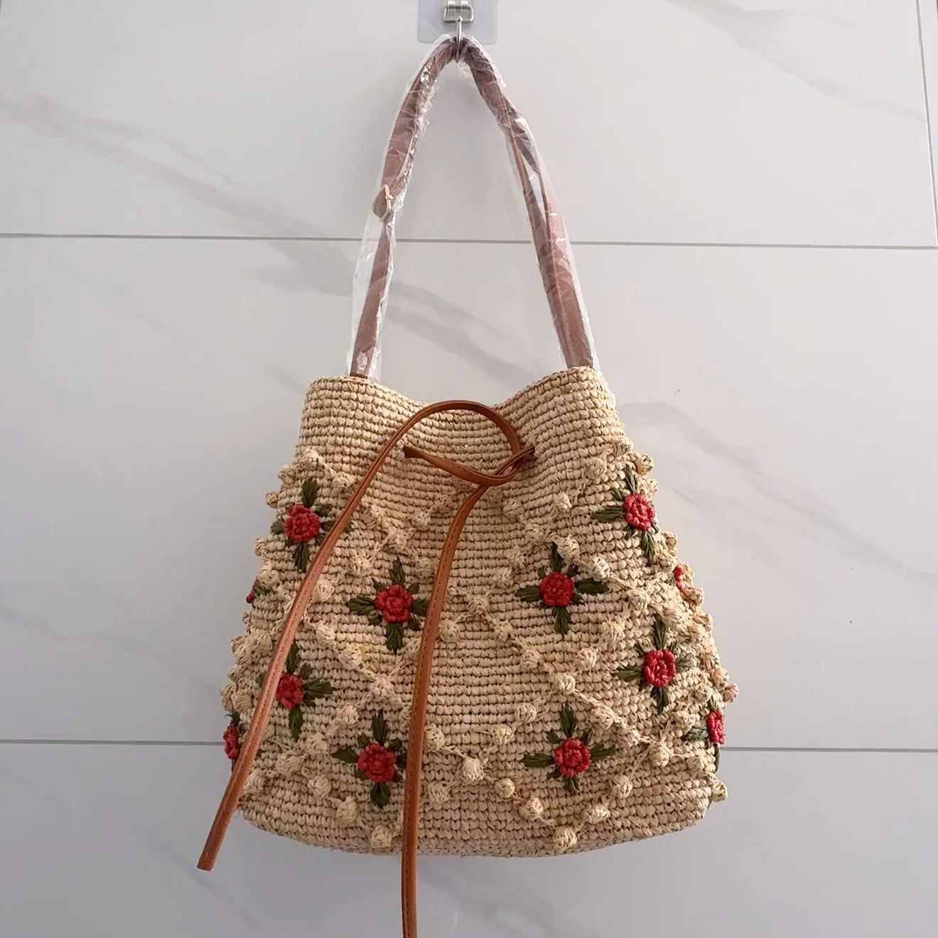 New French Handmade Lafite Grass Hollowed Out Woven Flower Petal Pattern Portable Women's Bag Seaside Vacation Fashion Bag Trend